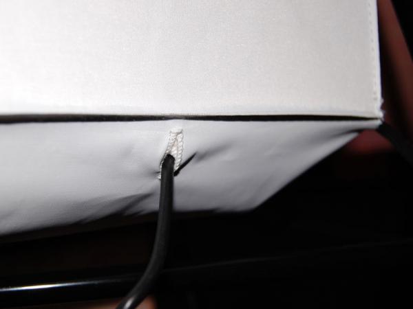 LED LightBox detail from behind the Plus Graphic Skin on the Express E kit. Shows the single power cord coming out of the back of the fabric LED LightBox